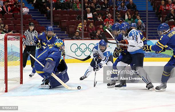 Emma Laaksonen of Finland attacks the Sweden goal during the ice hockey women's bronze medal game between Finland and Sweden on day 14 of the...