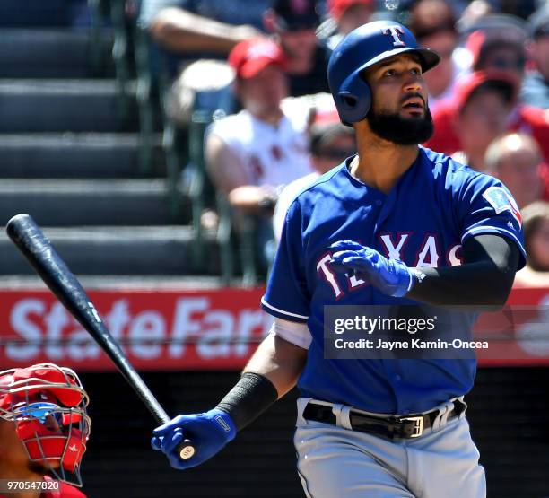 Nomar Mazara of the Texas Rangers his a solo home run in the eighth inning of the game against the Los Angeles Angels of Anaheim at Angel Stadium on...