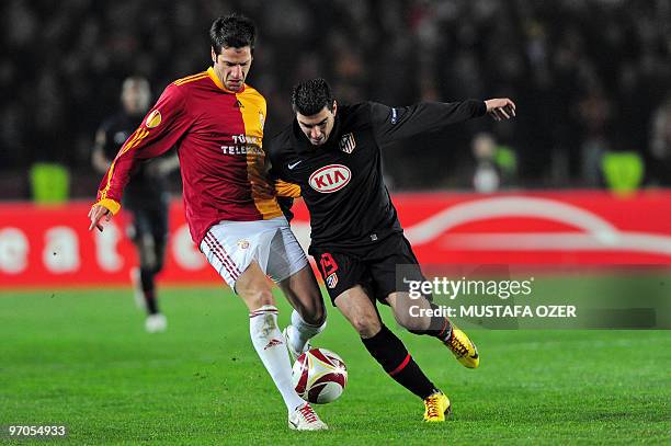 Jose Antonio Reyes of Atletico Madrid vies with Galatasaray's Hakan Balta during their UEFA Europa League football match at Ali Sami Yen Stadium...