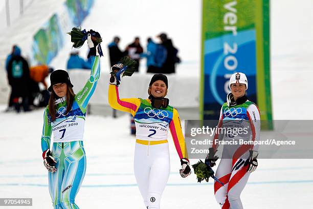 Viktoria Rebensburg of Germany takes the Gold Medal, Tina Maze of Slovenia takes the Silver Medal, Elisabeth Goergl of Austria takes the Bronze Medal...