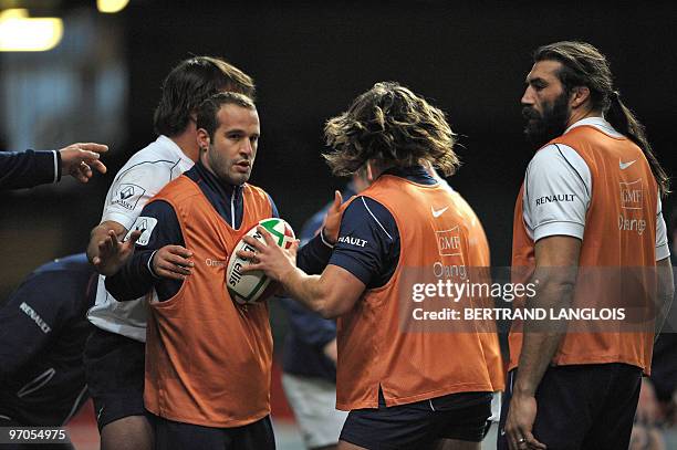 French rugby union national team's fly-half Frederic Michalak and lock Sebastien Chabal take part in a training session at the Millenium stadium in...