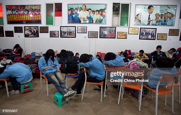 Migrant workers rest in a meeting room at the Shenzhen Quanshun Human Resources Co., Ltd, on February 23, 2010 in Shenzhen of Guangdong Province,...