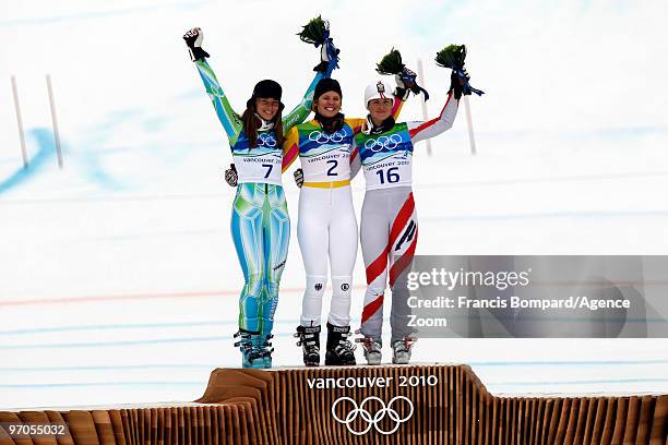 Viktoria Rebensburg of Germany takes the Gold Medal, Tina Maze of Slovenia takes the Silver Medal, Elisabeth Goergl of Austria takes the Bronze Medal...