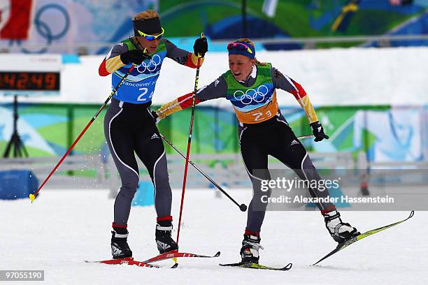 Miriam Gossner of Germany hands over to Claudia Nystad during the Ladies' Cross Country 4x5 km Relay on day 14 of the 2010 Vancouver Winter Olympics...