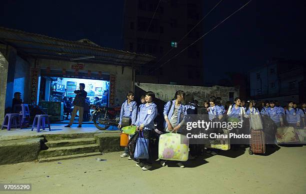 Migrant workers depart for a factory at the Shenzhen Quanshun Human Resources Co., Ltd, on February 23, 2010 in Shenzhen of Guangdong Province,...