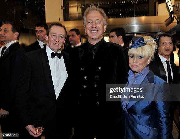 Actors Paul Whitehouse, Alan Rickman and Barbara Windsor share a joke as they attend the Royal World Premiere of Tim Burton's 'Alice In Wonderland'...