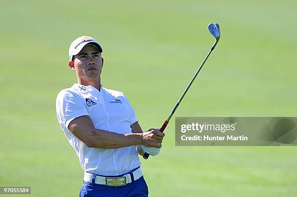 Camilo Villegas of Colombia watches his second shot on the 18th hole during the first round of the Waste Management Phoenix Open at TPC Scottsdale on...