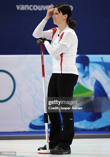 Carmen Kueng of Switzerland leans on her broom during the women's curling semi-final game between Canada and Switzerland on day 14 of the Vancouver...