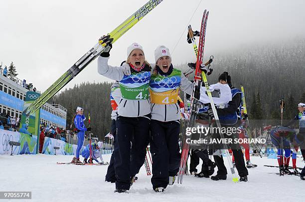 Norway's bronze medalists Therese Johaug and Kristin Stoemer Steira react after the women's Cross Country Skiing 4x5 km relay at Whistler Olympic...