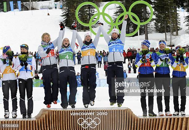 Norway's gold medalists Vibeke W Skofterud, Norway'sTherese Johaug, Norway's Kristin Stoemer Steira and Norway's Marit Bjoergen celebrate on the...