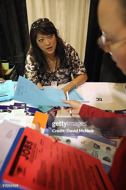 Census recruiting assistant Terrie Valdez-Rubio talks to job seekers about the 2,300 census job openings in San Bernardino County at the Inland...