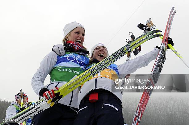 Norway's gold medalists Therese Johaug and Kristin Stoemer Steira react after the women's Cross Country Skiing 4x5 km relay at Whistler Olympic Park...
