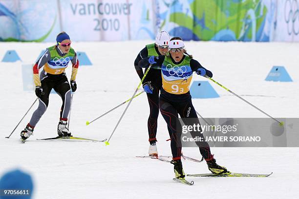 France's Celia Bourgeois , France's Karine Laurent Philippot and Germany's Miriam Gossner ski as they compete in the women's Cross Country Skiing 4x5...