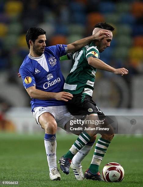 Marat Izmailov of Sporting battles with Mikel Arteta of Everton during the UEFA Europa League Round of 32, 2nd leg match between Sporting Lisbon and...