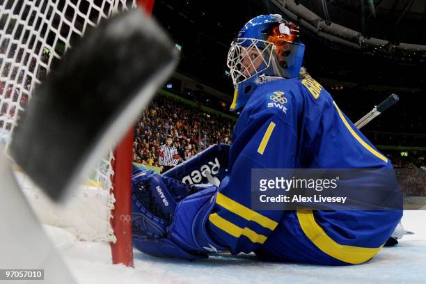 Goalkeeper Sara Grahn of Sweden watches the puck fly into the net as Saara Tuominen of Finland scores the match winning goal in overtime during the...