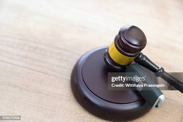 close up of wooden judge gavel and car keys over soundboard - car studio shot stock pictures, royalty-free photos & images