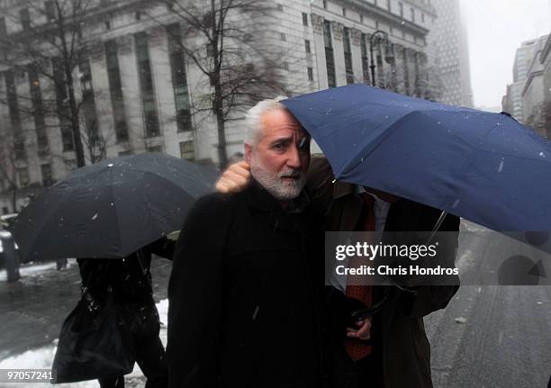 Daniel Bonventre , former director of operations for disgraced financier Bernard Madoff, is escorted out of court February 25, 2010 in New York City....