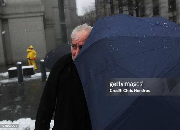 Daniel Bonventre, former director of operations for disgraced financier Bernard Madoff, is escorted out of court February 25, 2010 in New York City....