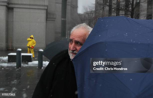 Daniel Bonventre, former director of operations for disgraced financier Bernard Madoff, is escorted out of court February 25, 2010 in New York City....