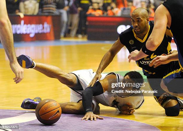 Lawrence Roberts, #4 of Partizan Belgrade competes with Jamon Lucas, #22 of Maroussi BC during the Euroleague Basketball 2009-2010 Last 16 Game 4...