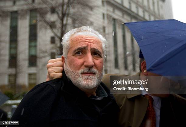 Daniel Bonventre, former operations chief for Bernard M. Madoff, left, leaves federal court following a hearing in New York, U.S., on Thursday, Feb....