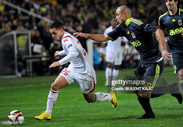 Lille's Pierre Eden Hazard fights for the ball with Fenerbahce's Bilica from Brazil during their UEFA Europa League football match at Sukru Saracoglu...