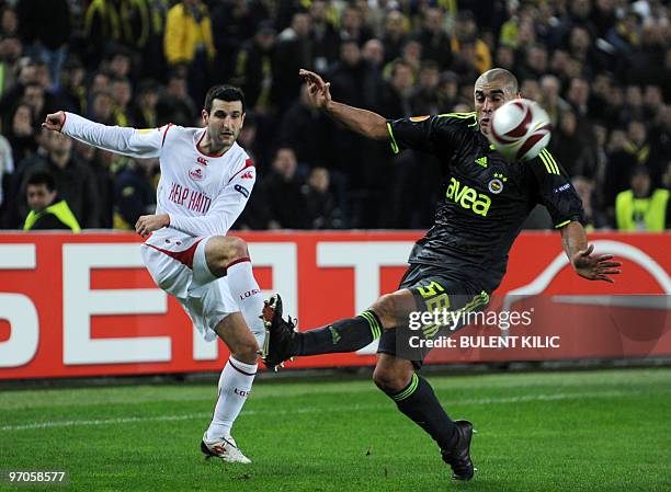 Lille's Pierre Alain Frau fights for the ball with Fenerbahce's Bilica from Brazil during their UEFA Europa League football match at Sukru Saracoglu...