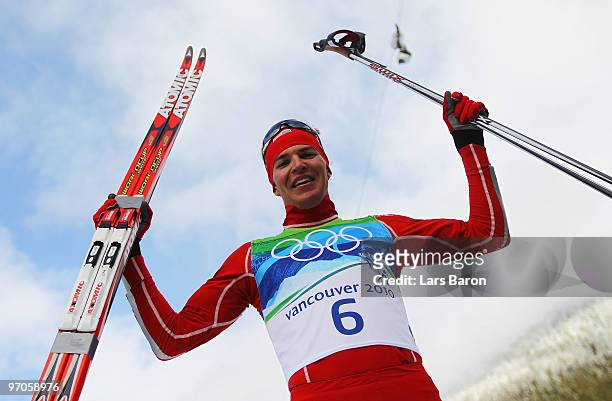 Bill Demong of the United States celebrates winning the gold medal in the Nordic Combined Individual LH/10 km on day 14 of the 2010 Vancouver Winter...