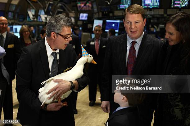 The Aflac Duck and President and COO of Aflac Paul Amos walk the trading floor during the closing bell at the New York Stock Exchange on February 25,...