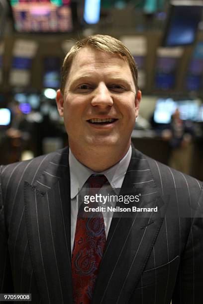 President and COO of Aflac Paul Amos walks the trading floor during the closing bell at the New York Stock Exchange on February 25, 2010 in New York...