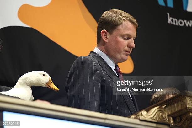 The Aflac Duck and President and COO of Aflac Paul Amos ring the closing bell at the New York Stock Exchange on February 25, 2010 in New York City.