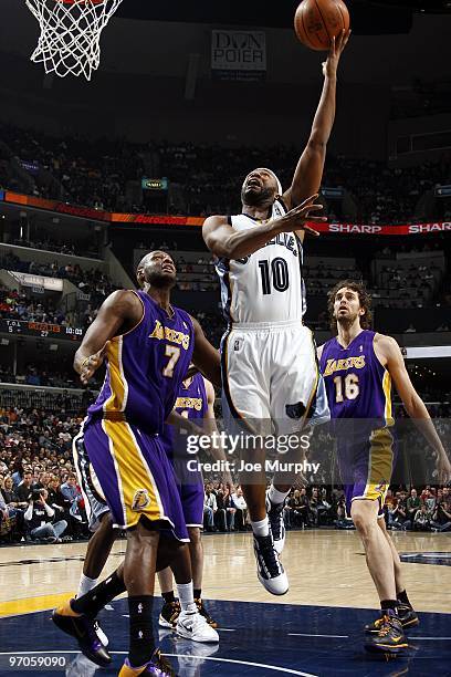 Jamaal Tinsley of the Memphis Grizzlies shoots a layup against Lamar Odom and Pau Gasol of the Los Angeles Lakers during the game at the FedExForum...