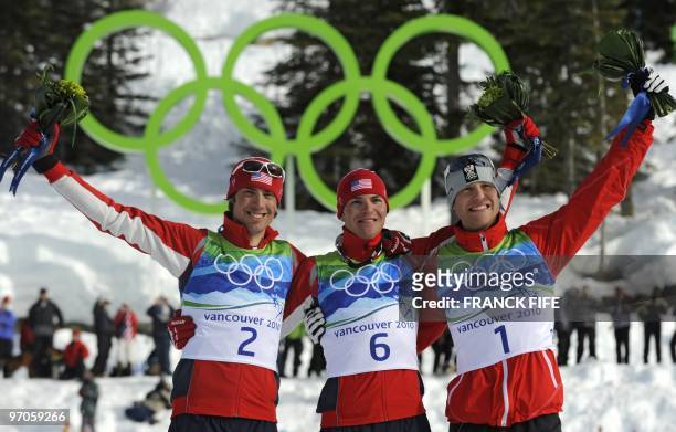 Gold medalist Bill Demong of the US , compatriot silver medalist Johnny Spillane and Austria's bronze medalist Bernhard Gruber stand on the podium...