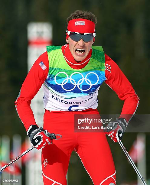 Bill Demong crosses the finish line to win the Nordic Combined Individual LH/10 km on day 14 of the 2010 Vancouver Winter Olympics at Whistler...