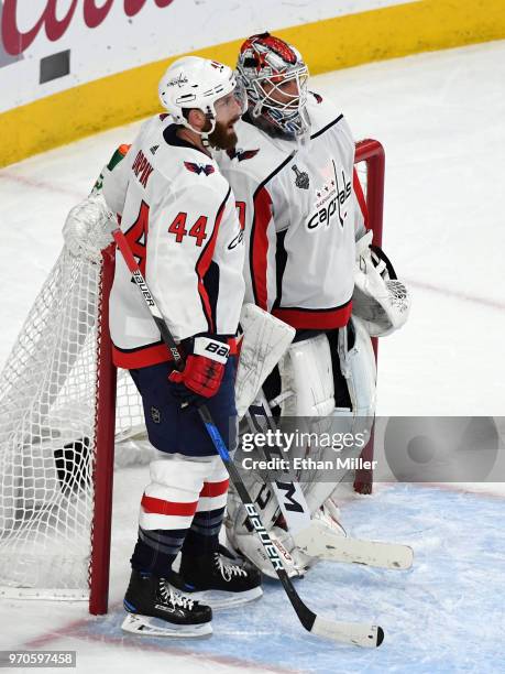 Brooks Orpik and Braden Holtby of the Washington Capitals talk late in the third period of Game Five of the 2018 NHL Stanley Cup Final against the...