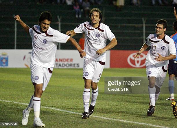 Santiago Salcedo , Jadson Viera and Santiago Hoyos of Argentinian Lanus celebrate after the second goal of their team against Bolivian Blooming on...