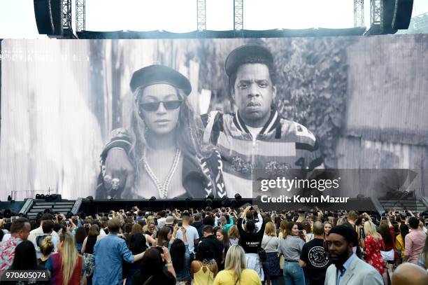 An image of Beyonce and Jay-Z is projected before they appear to perform on stage during the "On the Run II" Tour at Hampden Park on June 9, 2018 in...