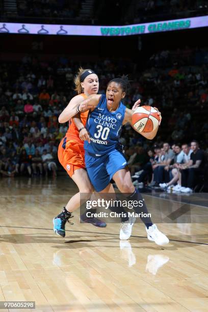 Tanisha Wright of the Minnesota Lynx handles the ball against the Connecticut Sun on June 9, 2018 at the Mohegan Sun Arena in Uncasville,...