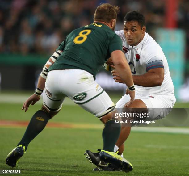 Billy Vunipola of England takes on Duane Vermeulen during the first test match between South Africa and England at Elllis Park on June 9, 2018 in...