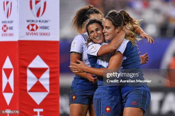 Marjorie Mayans of France is congratulated by teammate Shannon Izar after she scored a try during the Rugby Sevens match between Australia and France...