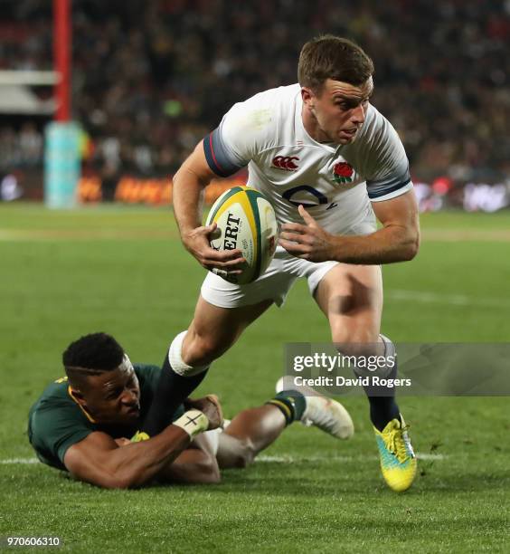 George Ford of England is tackkled by Aphiwe Dyantyi during the first test match between South Africa and England at Elllis Park on June 9, 2018 in...