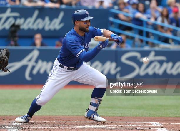 Kevin Pillar of the Toronto Blue Jays hits a bunt single in the second inning during MLB game action against the Baltimore Orioles at Rogers Centre...