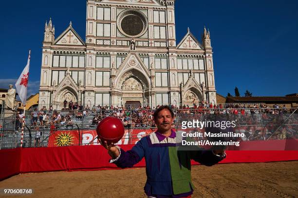 Man in traditional dress holds balls before the semi-final match of The Calcio Storico Fiorentino between the Santa Maria Novella Team and tthe Mixed...