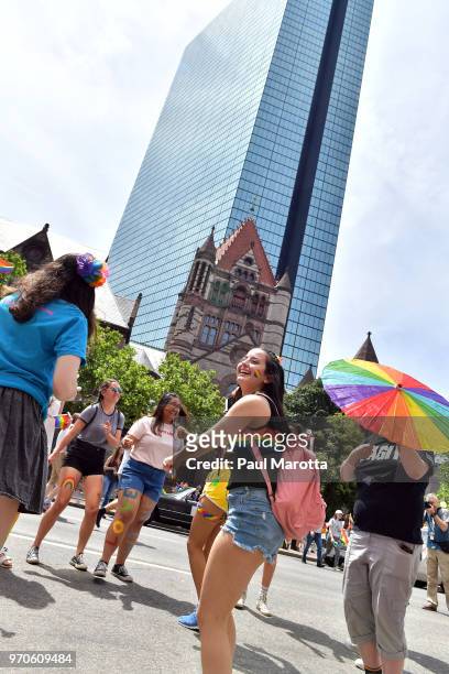 Young people dance on Boylston Street prior to the start of the 48th annual Boston Pride Parade on June 9, 2018 in Boston, Massachusetts.