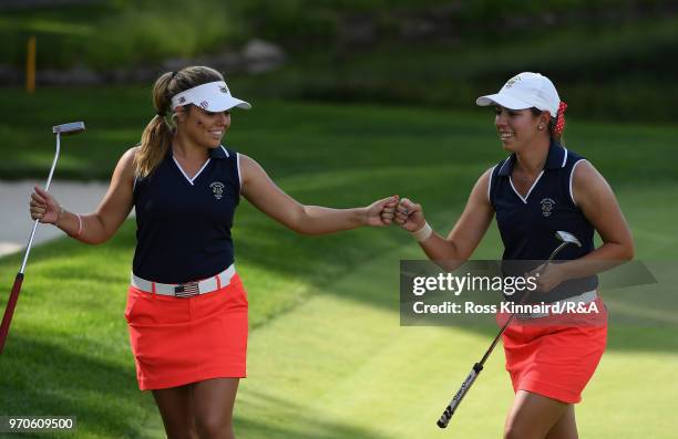 Lauren Stephenson and Kristen Gillman of the United States team celebrate on the fifth green in their match against Annabell Fuller and India Clyburn...