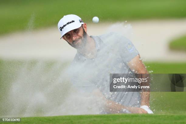Dustin Johnson plays a shot from a bunker on the 16th hole during the third round of the FedEx St. Jude Classic at TPC Southwind on June 9, 2018 in...