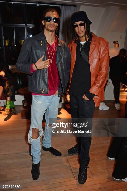 Kelvin Bueno and James Magee attend the London Fashion Week Men's cocktail party with DANIEL w. FLETCHER and Christian Louboutin at Mortimer House on...