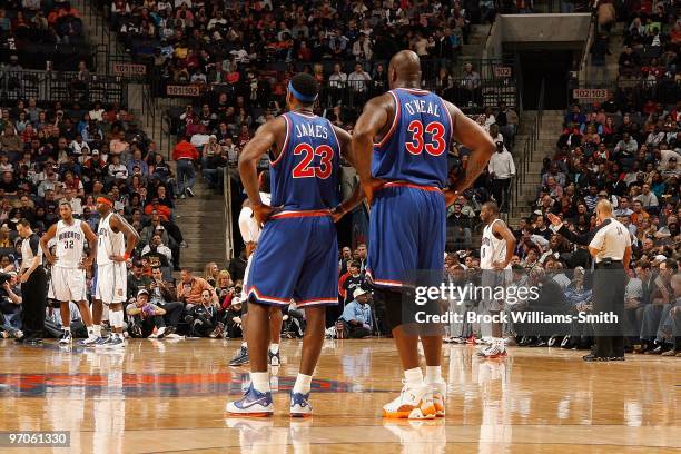 LeBron James and Shaquille O'Neal of the Cleveland Cavaliers stand on the court during the game against the Charlotte Bobcats on February 19, 2010 at...