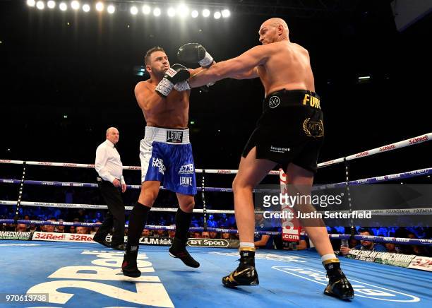 Tyson Fury punches Sefer Seferi during there heavyweight contest at Manchester Arena on June 9, 2018 in Manchester, England.