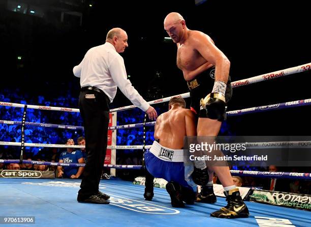 The referee speaks with Tyson Fury and Sefer Seferi during there heavyweight contest at Manchester Arena on June 9, 2018 in Manchester, England.